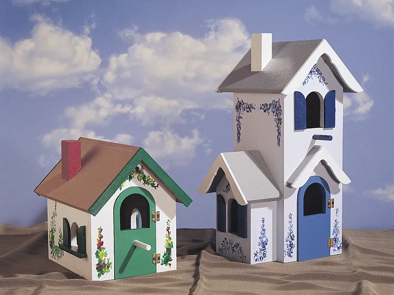 Two Victorian birdhouse styles with one taller and another style shorter