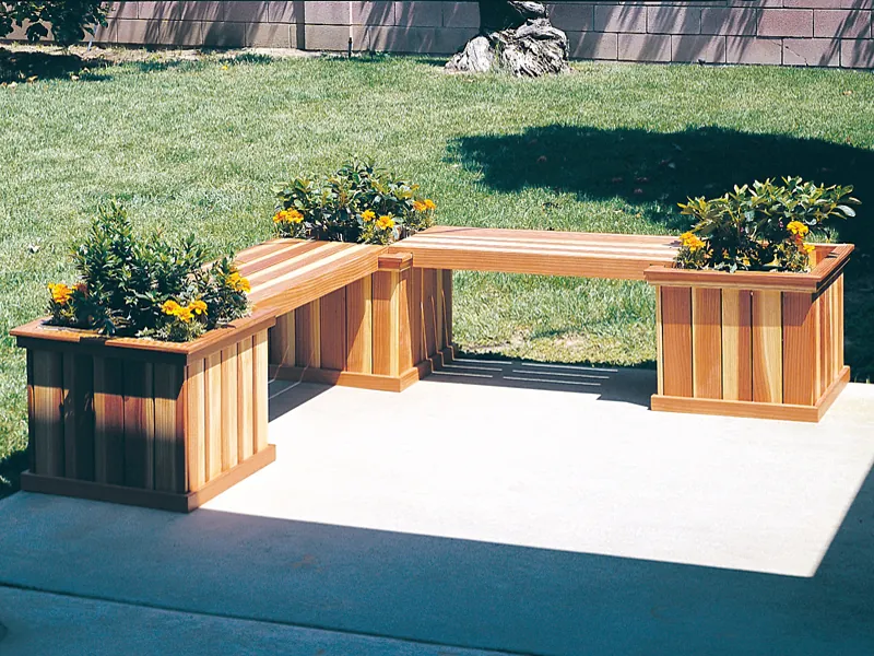 L-shaped planter bench has three square planters and two sections of bench space for the patio