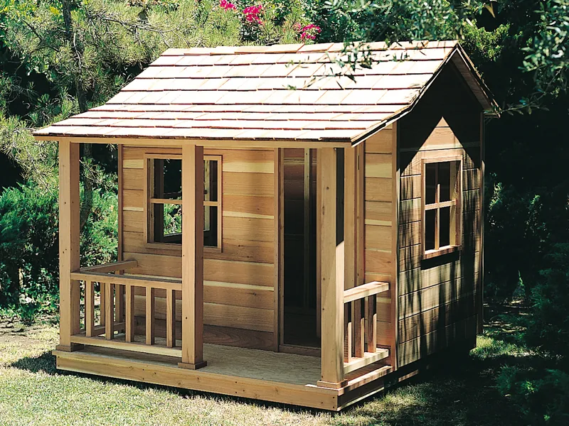 Rustic children's playhouse with side windows and covered front porch